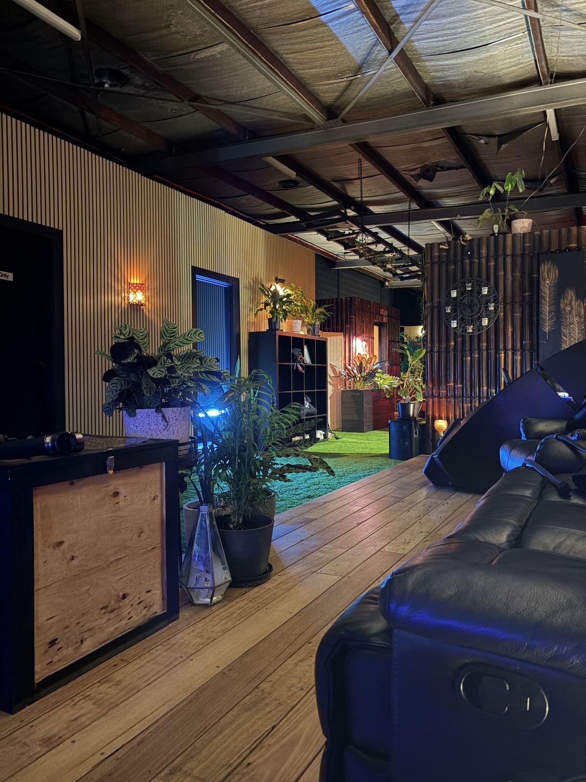 Timber lounge with plants and recliners